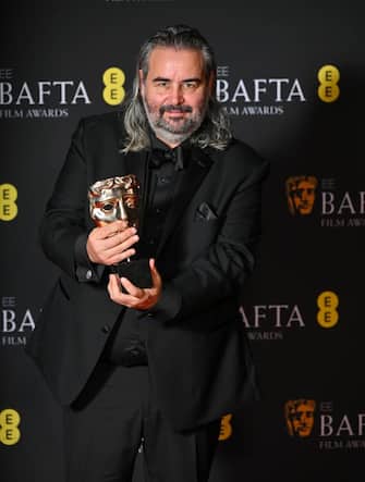 LONDON, ENGLAND - FEBRUARY 18:  Hoyte van Hoytema poses with the Cinematography Award for 'Oppenheimer poses in the winners room at the 2024 EE BAFTA Film Awards at The Royal Festival Hall on February 18, 2024 in London, England. (Photo by Samir Hussein/WireImage)