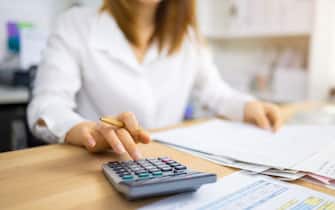 Financial auditor analyzing company financial report concept of accounting, accountancy and tax form