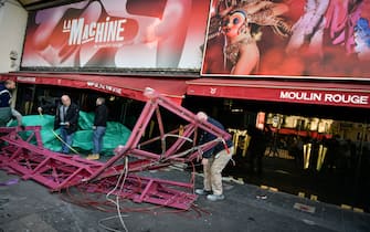 Workers remove the wings of the Moulin Rouge cabaret in Paris on April 25, 2024, after it collapsed last evening. The wings of the windmill on top of the famous Moulin Rouge cabaret fell off during the night on Wednesday the Paris fire department said. No injuries were reported, they said, adding that there was no longer any risk of further collapse. The reasons for the fall are currently unknown. It caused damage to the front of the cabaret, bringing down with it the first three letters of the illuminated sign. Images on social media showed the blade unit lying on the street below, with some of the blades slightly bent from the apparent fall. Photo by Firas Abdullah/ABACAPRESS.COM