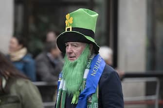 LONDON, UNITED KINGDOM - MARCH 12: A man wearing a green hat and a beard at the Trafalgar Square during the Saint Patrick's Day Festival in London, United Kingdom on March 12, 2023. Saint PatrickÃ¢s Day is one of the IrelandÃ¢s national days. Associations, sports clubs and orchestras from various regions of United Kingdom and Ireland, citizens of other countries living in London attended the Saint PatrickÃ¢s Day celebrations with their traditional costumes, make-up and music. (Photo by Rasid Necati Aslim/Anadolu Agency via Getty Images)