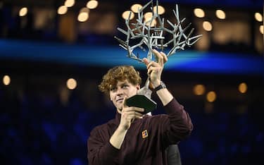 Italy's Jannik Sinner celebrates with the trophy after winning the men's singles final match of the Paris ATP Masters 1000 tennis tournament against Canada's Felix Auger-Aliassime at the Paris La DÃ©fense Arena in Nanterre, on the outskirts of Paris, on November 2, 2025. (Photo by JULIEN DE ROSA / AFP) (Photo by JULIEN DE ROSA/AFP via Getty Images)          