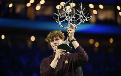 Italy's Jannik Sinner celebrates with the trophy after winning the men's singles final match of the Paris ATP Masters 1000 tennis tournament against Canada's Felix Auger-Aliassime at the Paris La DÃ©fense Arena in Nanterre, on the outskirts of Paris, on November 2, 2025. (Photo by JULIEN DE ROSA / AFP) (Photo by JULIEN DE ROSA/AFP via Getty Images)          