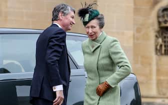 Britain's Princess Anne, Princess Royal (R) and Vice Admiral Timothy Laurence (L) react upon their arrival at St. George's Chapel, Windsor Castle, to attend the Easter Mattins Service, on March 31, 2024. (Photo by Hollie Adams / POOL / AFP)