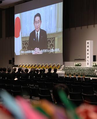 epa10791469 A video message from Japanese Prime Minister Fumio Kishida is screened during an indoor memorial service in Nagasaki, Nagasaki Prefecture, 09 August 2023, marking the 78th anniversary of the bombing. Nagasaki City was forced to change the schedule of the memorial service for victims due to typhoon Khanun. Nagasaki City has announced the toll of victims by the atomic bombing rose to about 74,000. The figure was counted as the end of 1945 after the August 9 bombing. The indoor memorial service is the first time in 60 years.  EPA/JIJI PRESS JAPAN OUT EDITORIAL USE ONLY/