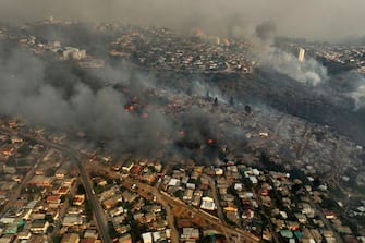 Aerial view of the forest fire that affects the hills of the city of ViÃ±a del Mar in the Las Pataguas sector, Chile, taken on February 3, 2024. The region of Valparaoso and ViÃ±a del Mar, in central Chile, woke up on Saturday with a partial curfew to allow the movement of evacuees and the transfer of emergency equipment in the midst of a series of unprecedented fires, authorities reported. (Photo by Javier TORRES / AFP) (Photo by JAVIER TORRES/AFP via Getty Images)