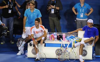 Roger Federer, Novak Djokovic and Rafael Nadal relax and watch their respective teamates during a fundraising "Hit for Haiti" organised by Roger Federer to support the victims of the Haiti earthquake.