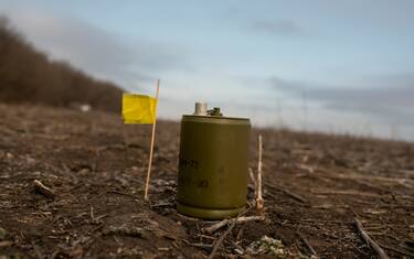 DONETSK OBLAST, UKRAINE - JANUARY 28: An anti-personnel mine and a yellow flag sit on the ground during conducting of the territory mining exercise on January 28, 2023 in Donetsk Oblast, Ukraine. Russian occupation forces, continuing to focus their efforts on establishing control over the entire Donetsk Oblast, have increased their military personnel and intensified shelling along the entire front line in the east of the country. (Photo by Viktor Fridshon/Global Images Ukraine via Getty Images)