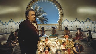 View of Italian film director Federico Fellini (1920 - 1993), along with unidentified cast members, on the set of his film 'Amarcord,' at Cinecitta Studios, Rome, Italy, circa 1973. (Photo by Franco Pinna/Photo Researchers History/Getty Images)
