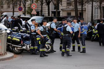 epa11569355 French policemen block a street leading to the Paralympic Opening Ceremony, next to the Elysee Palace in Paris Palace in Paris, France, 28 August 2024. The Paralympic Games of Paris 2024 will be held from August 28 to September 08, 2024.  EPA/ANDRE PAIN