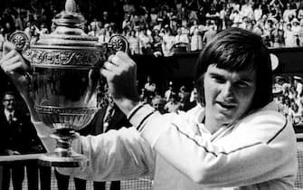 Jimmy Connors celebrates with the men's singles trophy