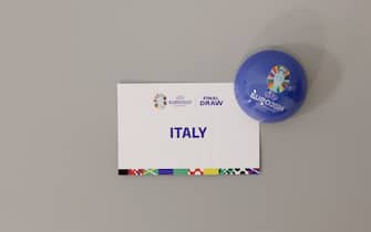HAMBURG, GERMANY - DECEMBER 01: A detailed view of the draw card of Italy is seen ahead of the UEFA EURO 2024 Final Tournament Draw at Elbphilharmonie on December 01, 2023 in Hamburg, Germany. (Photo by Lars Baron - UEFA/UEFA via Getty Images)