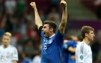 epa03286954 Italian player Andrea Barzagli celebrates in front of German players after the semi final match of the UEFA EURO 2012 between Germany and Italy in Warsaw, Poland, 28 June 2012. Italy won 2-0.  EPA/OLIVER WEIKEN UEFA Terms and Conditions apply http://www.epa.eu/downloads/UEFA-EURO2012-TCS.pdf