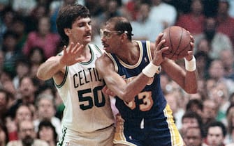 (Original Caption) 6/7/1987-Boston, MA- Celtics', Greg Kite(left), guards Laker's, Kareem Abdul-Jabbar, closely in the 3rd quarter of the 3rd game, in the NBA Finals at the Boston Garden.