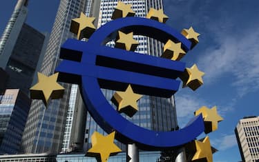 Euro logo by German visual artist Ottmar Hörl in front of the Eurotower in Frankfurt am Main, Hesse, Germany.
