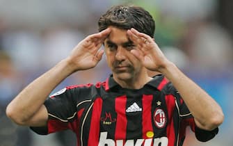 Milan, ITALY: AC Milan's captain defender Alessandro Costacurta (C) salutes his supporters as he leaves the field at the end of his last match against Udinese, during of Italian serie A football match at San Siro stadium, 19 May 2007. Costacurta scored in his last home match before hanging up his boots, but his goal could not prevent the Champions League finalists from losing 3-2 to Udinese.   AFP PHOTO/ANDREAS SOLARO (Photo credit should read ANDREAS SOLARO/AFP via Getty Images)