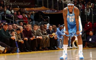 LOS ANGELES - JANUARY 2:  Carmelo Anthony #15 of the Denver Nuggets laughs between plays against the Los Angeles Lakers January 2, 2005 at the Staples Center in Los Angeles, California. NOTE TO USER: User expressly acknowledges and agrees that, by downloading and/or using this Photograph, user is consenting to the terms and conditions of Getty Images License Agreement. Mandatory Copyright Notice: Copyright 2004 NBAE  (Photo by Andrew D. Bernstein/NBAE via Getty Images)