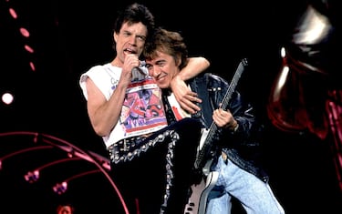 British musicians Mick Jagger (left) and Bill Wyman of the Rolling Stones performs on stage during the band's 'Steel Wheels' tour, late 1989. (Photo by Paul Natkin/Getty Images)