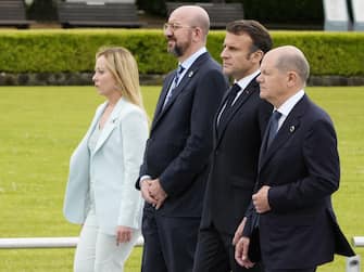 epa10638031 (L-R) Italian Prime Minister Giorgia Meloni, European Council President Charles Michel, French President Emmanuel Macron, and German Chancellor Olaf Scholz walk to a flower wreath laying ceremony at the Cenotaph for Atomic Bomb Victims in the Peace Memorial Park as part of the G7 Hiroshima Summit in Hiroshima, Japan, 19  May 2023. The G7 Hiroshima Summit will be held from 19-21 May 2023.  EPA/FRANCK ROBICHON / POOL