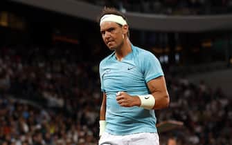 epa11373526 Rafael Nadal of Spain reacts during his Men's Singles 1st round match against Alexander Zverev of Germany during the French Open Grand Slam tennis tournament at Roland Garros in Paris, France, 27 May 2024.  EPA/YOAN VALAT