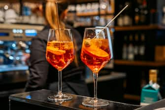 traditional Italian cocktail Spritz with ice and olives, an aperitif in Rome, Milan Venice Florence