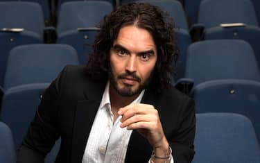 LONDON, ENGLAND - NOVEMBER 25:  Russell Brand poses for photographs as he arrives to deliver The Reading Agency Lecture at The Institute of Education on November 25, 2014 in London, England. Russell Brand will deliver 'a manifesto on reading' which will be in part personal, sharing his own experience of books and reading while growing up in the UK.  (Photo by Carl Court/Getty Images)