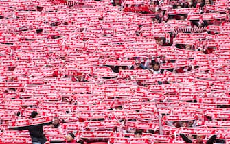 02 April 2023, North Rhine-Westphalia, Cologne: Soccer, Bundesliga, 1. FC Köln - Borussia Mönchengladbach, Matchday 26, RheinEnergieStadion. Cologne fans hold their fan scarves with the inscription "Geliebter Fußballclub. Photo: Marius Becker/dpa - IMPORTANT NOTE: In accordance with the requirements of the DFL Deutsche Fußball Liga and the DFB Deutscher Fußball-Bund, it is prohibited to use or have used photographs taken in the stadium and/or of the match in the form of sequence pictures and/or video-like photo series.