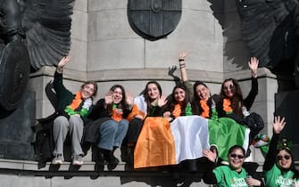 DUBLIN, IRELAND - MARCH 17: A group of women pose for a photo during the St. Patrick's Day parade on March 17, 2024 in Dublin, Ireland. This year's theme of the parade is Spréach, the Irish word for Spark,  which is said to represent the unique essence of Ireland and its people. The parade starts at midday on Parnell Square North down then moves to O'Connell Street and crosses the River Liffey. (Photo by Charles McQuillan/Getty Images)