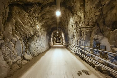 One way road tunnel excavated inside marble rocks in Carrara, Tuscany, Italy