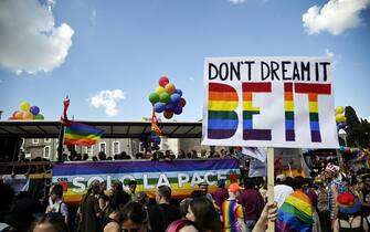 Members and supporters of the lesbian, gay, bisexual and transgender (LGBT) community take part in the Pride parade in Rome, Italy, 11 June 2022. ANSA/RICCARDO ANTIMIANI