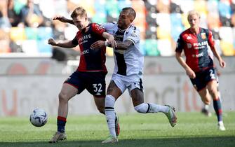 Udinese's Roberto Pereyra (R) and Genoa's Morten Frendrup in action during the Italian Serie A soccer match Udinese Calcio vs Genoa CFC at the Friuli - Dacia Arena stadium in Udine, Italy, 1 October 2023. ANSA / GABRIELE MENIS