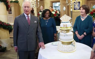 TETBURY, ENGLAND - NOVEMBER 13: King Charles III poses with his cake as he attends his 75th birthday party hosted by the Prince's Foundation at Highgrove House on November 13, 2023 in Tetbury, England. Guests include local residents who have been nominated by friends and family and individuals and organisations also turning 75 in 2023. (Photo by Chris Jackson/Getty Images)