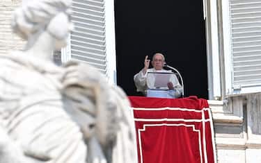 Pope Francis blesses the crowd from the window of the apostolic palace overlooking St. Peter's square during the weekly Angelus prayer on August 20, 2023 in The Vatican. (Photo by Alberto PIZZOLI / AFP) (Photo by ALBERTO PIZZOLI/AFP via Getty Images)