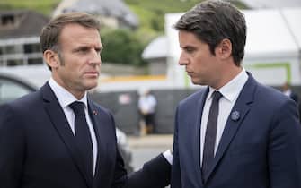 France's President Emmanuel Macron (L) welcomes France's Prime Minister Gabriel Attal upon his arrival to attend the International commemorative ceremony at Omaha Beach marking the 80th anniversary of the World War II "D-Day" Allied landings in Normandy, in Saint-Laurent-sur-Mer, in northwestern France, on June 6, 2024. //04SIPA_sipa0208/Credit:Blondet Eliot - Pool/SIPA/2406070609