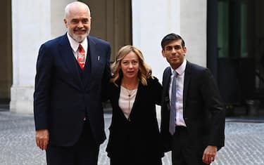 Italy's Prime Minister, Giorgia Meloni poses with Albanian Prime Minister Edi Rama (L) and British Prime Minister Rishi Sunak (R) at Palazzo Chigi prior their meeting in Rome on December 16, 2023. (Photo by Isabella BONOTTO / AFP)