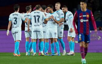 epa11022141 Girona's striker Artem Dovbyk (2-R) jubilates with his teammates after scoring the 0-1 during the Spanish LaLiga soccer match between FC Barcelona and Girona FC at Estadio Olimpico Lluis Companys stadium in Barcelona, Catalonia, Spain, 10 December 2023.  EPA/Siu Wu