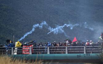 Protesters cash with security forces during a demonstration against the construction of a high-speed rail line between Lyon and Torino, in La Chapelle, near Modane and the Italian border, on June 17, 2023. Hundreds of oponents to the Lyon-Torino high-speed rail line demonstrated on June 17 despite a ban on the gathering, of which the details are yet to be determined and despite a heavy police presence in the valley. They set up a makeshift camp on land lent by the municipality of La Chapelle, outside the ban zone announced the day before by the Savoie prefecture. (Photo by OLIVIER CHASSIGNOLE / AFP) (Photo by OLIVIER CHASSIGNOLE/AFP via Getty Images)