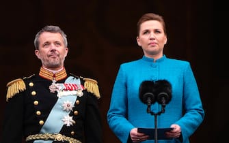 epa11076199 Danish Prime Minister Mette Frederiksen (R) proclaims King Frederik X's accession to the throne from the balcony at Christiansborg Palace in Copenhagen, Denmark, 14 January 2024. Denmark's Queen Margrethe II abdicated on 14 January 2024, the 52nd anniversary of her accession to the throne. Her eldest son, Crown Prince Frederik, succeeded his mother on the Danish throne as King Frederik X while his son, Prince Christian, became the new Crown Prince of Denmark following his father's coronation.  EPA/BO AMSTRUP DENMARK OUT