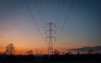 CHELTENHAM, UNITED KINGDOM - MARCH 11: Electrical pylons carry electricity cables across fields on March 11, 2023 near Cheltenham, England. The UK government has published documents with plans for Britain should it have to go â  lights outâ   this winter after the National Grid warned there could be blackouts due to the ongoing energy crisis. There are fears that Russian President Vladimir Putin will restrict gas supplies to Europe and although the UK does not rely on Russian energy supply, it does import from electricity and gas from European countries that do. With many consumers already facing a cost of living crisis with sharp rises in their home energy bills, energy black outs look set to compound their misery this winter. (Photo by Matt Cardy/Getty Images)