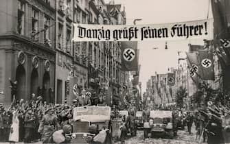 Adolf Hitler in Danzig ( Gdańsk ) “DANZIG SALUTES ITS LEADER” Poland 1939 invasion occupation with swastika flags and Heil Hitler salutes with a fleet of Mercedes motor cars parading by the occupation forces