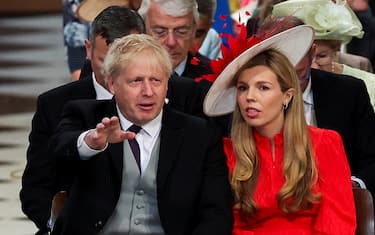 Britain's Prime Minister Boris Johnson and his wife Carrie Johnson wait for the start of the National Service of Thanksgiving for The Queen's reign at Saint Paul's Cathedral in London on June 3, 2022 as part of Queen Elizabeth II's platinum jubilee celebrations. - Queen Elizabeth II kicked off the first of four days of celebrations marking her record-breaking 70 years on the throne, to cheering crowds of tens of thousands of people. But the 96-year-old sovereign's appearance at the Platinum Jubilee -- a milestone never previously reached by a British monarch -- took its toll, forcing her to pull out of a planned church service. (Photo by PHIL NOBLE / POOL / AFP) (Photo by PHIL NOBLE/POOL/AFP via Getty Images)