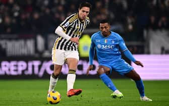Juventus' Italian forward #07 Federico Chiesa kicks the ball next to Napoli's Brazilian defender #05 Juan Jesus during the Italian Serie A football match between Juventus and Napoli, at The Allianz Stadium, in Turin on December 8, 2023. (Photo by Marco BERTORELLO / AFP)