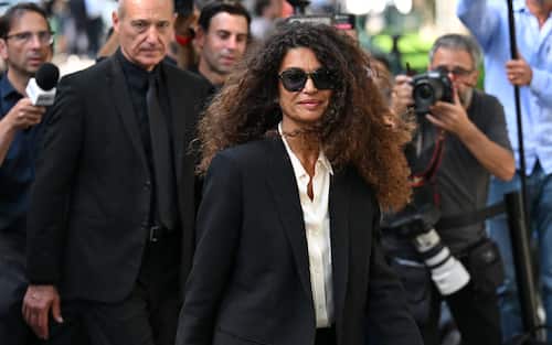 Italian-Tunisian former model and television presenter Afef Jnifen arrives to the Armani Theatre where late Italian fashion designer Giorgio Armani lies-in state, in Milan on September 7, 2025. Giorgio Armani died on September 4, 2025 at 91. (Photo by PIERO CRUCIATTI / AFP)