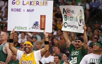 BOSTON - JUNE 8:  A Lakers fan holds a sign that shows support for Kobe Bryant #24 as a Boston fan hold a sign in support of the Celtics during Game Two of the 2008 NBA Finals between the Los Angeles and the Boston Celtics at TD Banknorth Garden on June 8, 2008 in Boston, Massachusetts.  The Celtics won 108-102.  NOTE TO USER: User expressly acknowledges and agrees that, by downloading and/or using this Photograph, user is consenting to the terms and conditions of the Getty Images License Agreement. Mandatory Copyright Notice: Copyright 2008 NBAE (Photo by David Sherman/NBAE via Getty Images)
