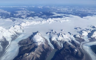 epa10539653 An aerial photograph shows the Darwin mountain range, which counts among the highest concentration of glaciers in the world, in Alberto de Agostini National Park on the island Isla Grande de Tierra del Fuego, Chile, 23 March 2023. Greenpeace warned on 22 March, World Water Day, that Chile faces an almost irreversible climate crisis due to global warming and the accelerated loss of glacial mass.  EPA/Javier Martin