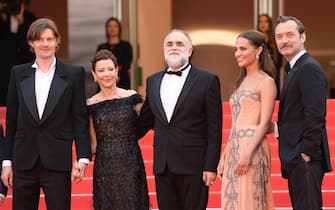 CANNES, FRANCE - MAY 21: (L-R) Sam Riley, Gabrielle Tana, director Karim Aïnouz, Alicia Vikander, and Jude Law attend the "Firebrand (Le Jeu De La Reine)" red carpet during the 76th annual Cannes film festival at Palais des Festivals on May 21, 2023 in Cannes, France. (Photo by Kristy Sparow/Getty Images)