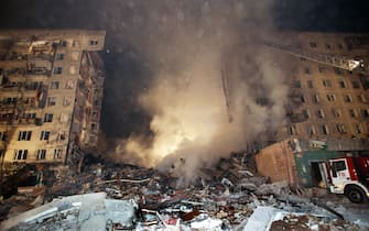 General view of an apartment block in Pechatniki suburb, southeast of Moscow,  after an explosion destroyed four storeys out of 18, of the building early 09 September 1999. At least 13 people died, 58 were injured and some 140 people are thought to be still trapped under rubble. Russia's emergencies minister Sergei Shoygu said he could not confirm that the explosion was caused by a gas leak.  (ELECTRONIC IMAGE)   (Photo credit should read STR/AFP via Getty Images)