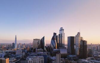 UK, London, elevated view over the city financial district skyline at sunset