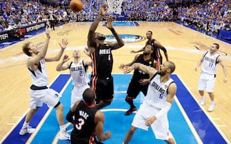 Dallas Mavericks' (from left wearing white) Dirk Nowitzki (41), Jason Kidd (2), Tyson Chandler (6) and Jose Juan Barea (11) go up for a rebound against Miami Heats' (from left wearing black) Dwyane Wade (3), Lebron James (6), Udonis Haslem (40) and Chris Bosh (1) during game 5 of the NBA Finals on June 9, 2011 at the American Airlines Center in Dallas, Texas.    AFP PHOTO / POOL / LUCY NICHOLSON (Photo credit should read LUCY NICHOLSON/AFP via Getty Images)