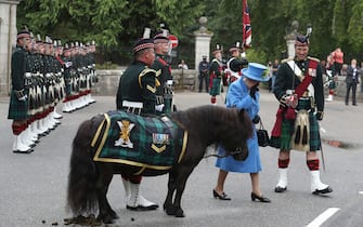 File photo dated 6/8/2018 of Queen Elizabeth II talking to Pony Major Mark Wilkinson with regimental mascot Cruachan IV alongside Officer Commanding Major Johnny Thompson as she inspects Balaclava Company, 5 Battalion The Royal Regiment of Scotland at the gates at Balmoral, as she took up summer residence at the castle. Scotland was a special place for the Queen over the decades, both for holidays and royal duties. She spent part of her honeymoon at Birkhall on the rural Balmoral estate in Aberdeenshire and the estate was her favoured residence in Scotland. Issue date: Thursday September 8, 2022.