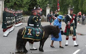 File photo dated 6/8/2018 of Queen Elizabeth II talking to Pony Major Mark Wilkinson with regimental mascot Cruachan IV alongside Officer Commanding Major Johnny Thompson as she inspects Balaclava Company, 5 Battalion The Royal Regiment of Scotland at the gates at Balmoral, as she took up summer residence at the castle. Scotland was a special place for the Queen over the decades, both for holidays and royal duties. She spent part of her honeymoon at Birkhall on the rural Balmoral estate in Aberdeenshire and the estate was her favoured residence in Scotland. Issue date: Thursday September 8, 2022.